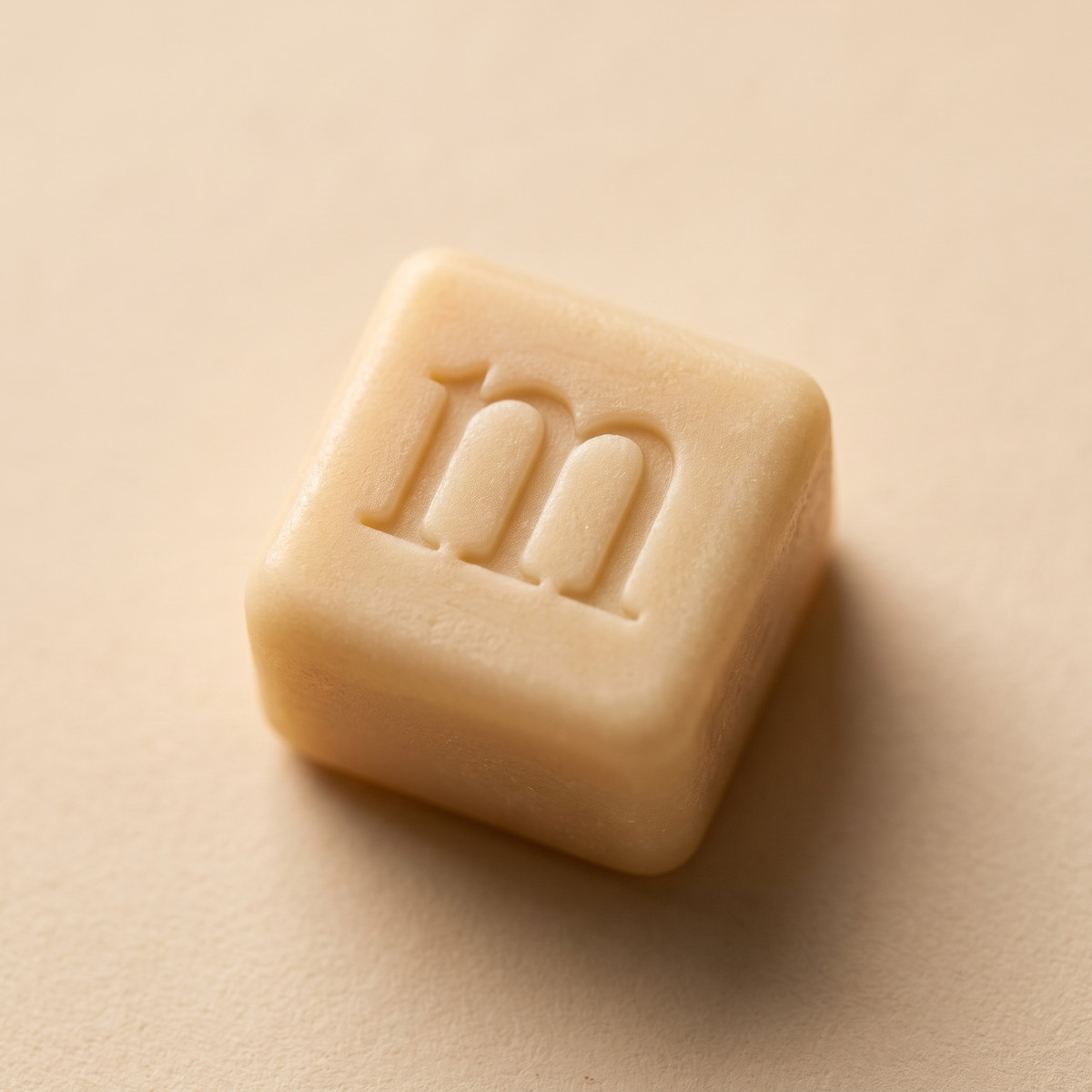 The m pressed into the cube