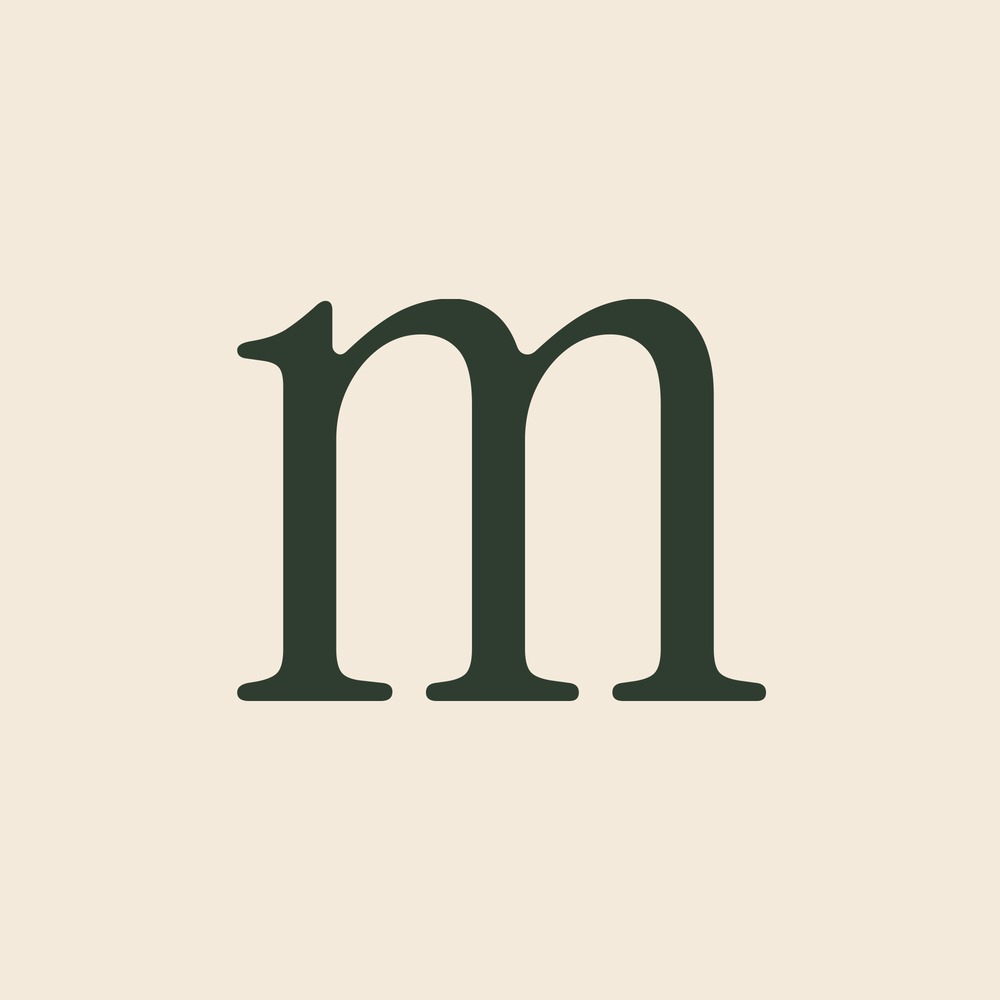 The lowercase m, cut from the typeface